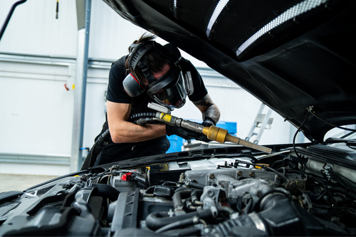 Automotive dry ice blasting and preservation being carried out on a car