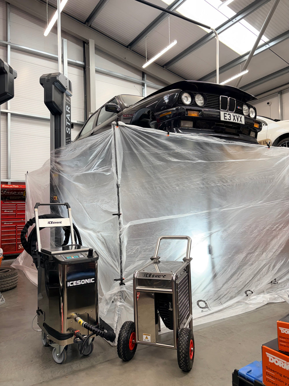 BMW on lift at EVOGENIC dry ice blasting
