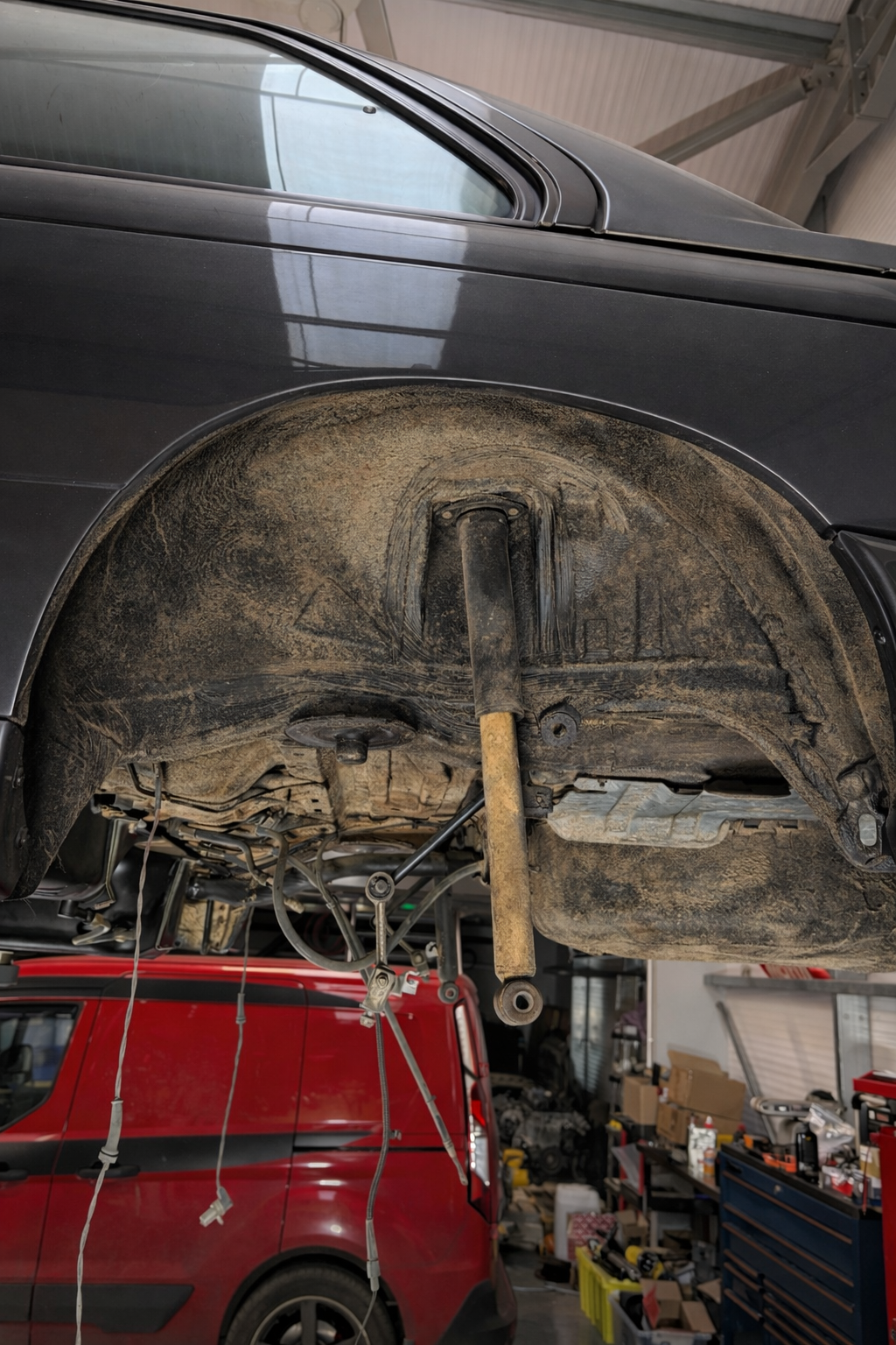 Car wheel arch and suspension components before dry ice blasting