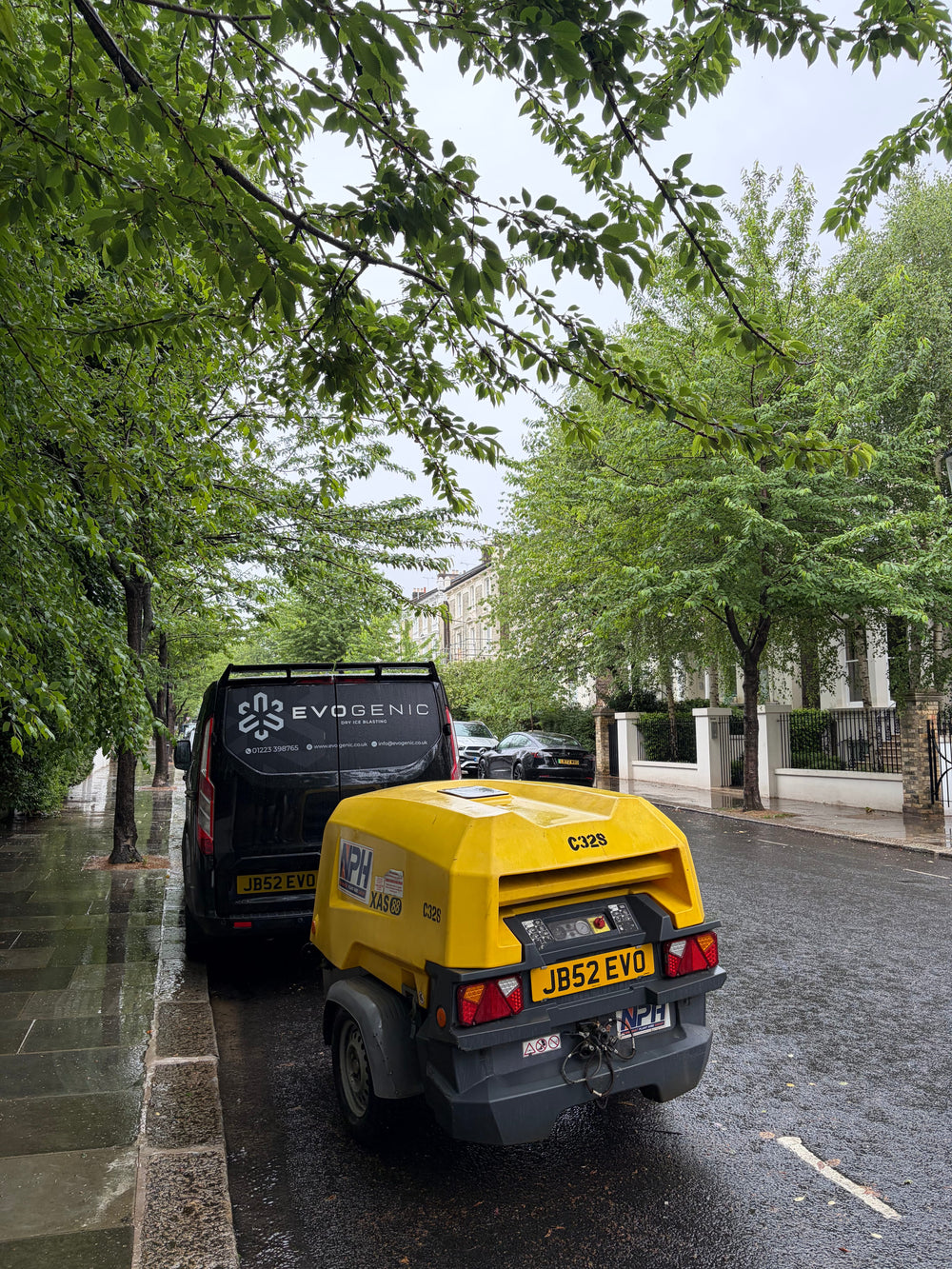 EVOGENIC van parted on street of fire damaged property with dry ice blasting equipment 