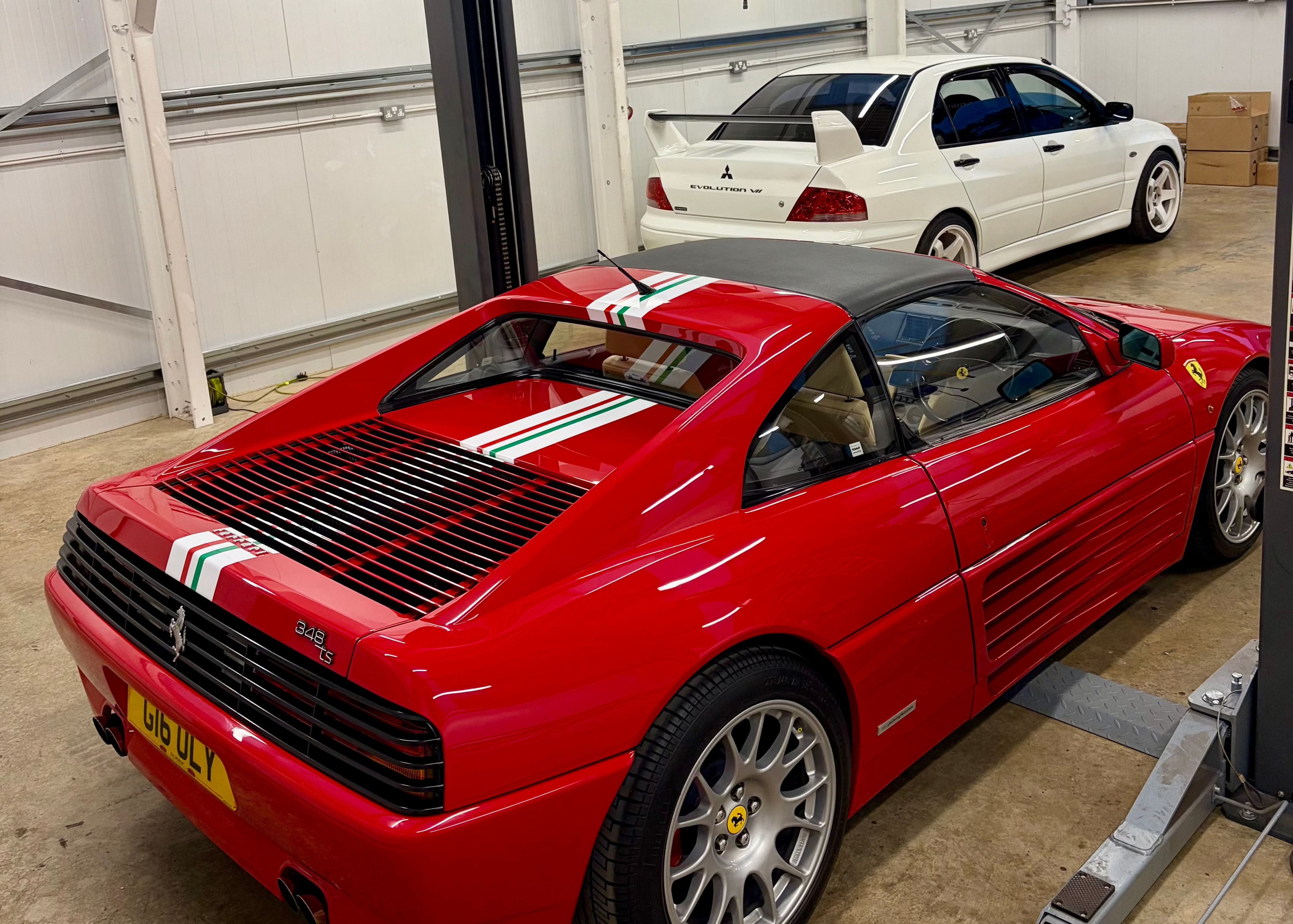Red Ferrari 348 and Mitsubishi Evo in EVOGENIC dry ice blasting unit