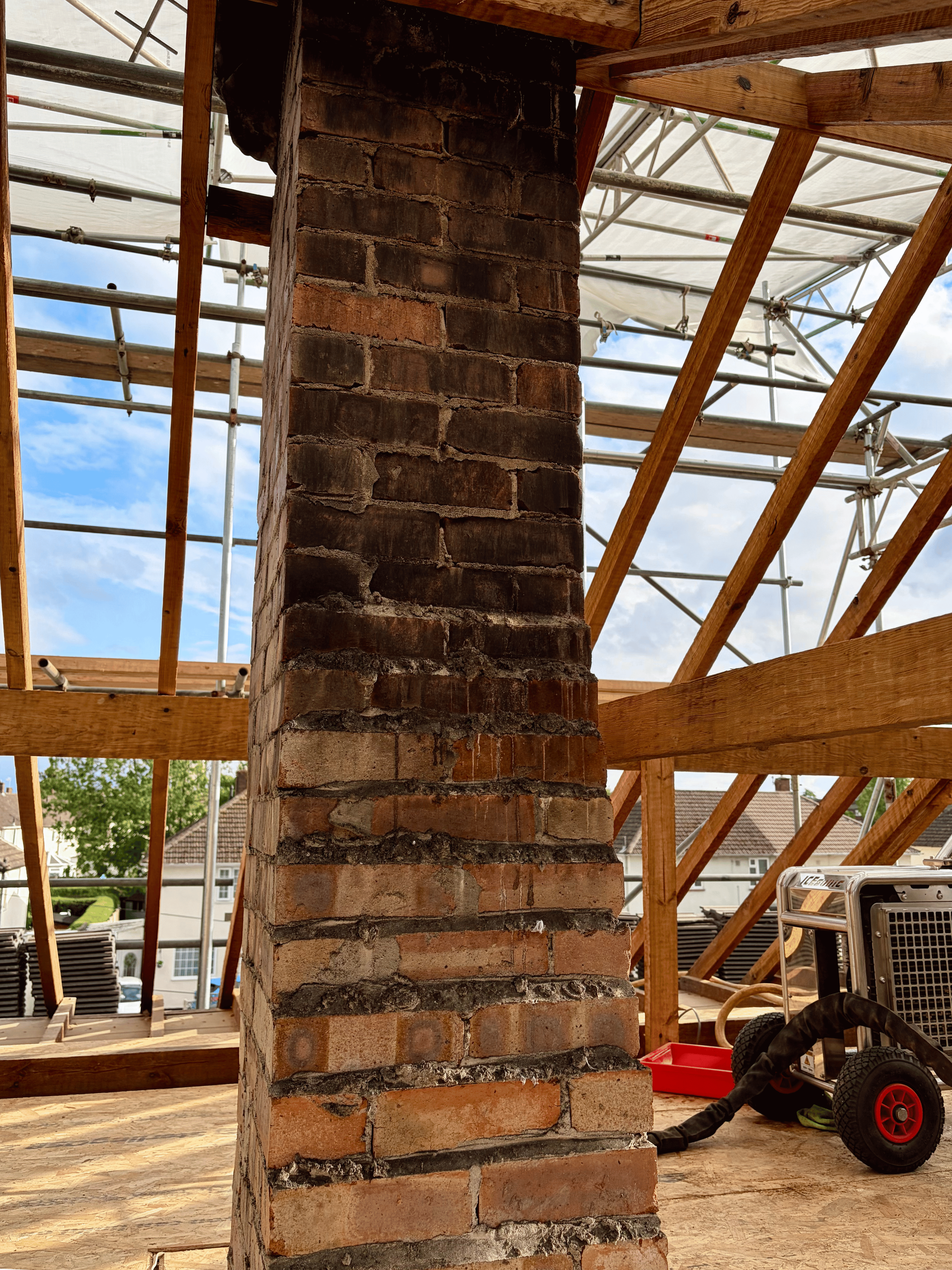 Fire and soot damaged chimney stack brickwork before dry ice blasting 