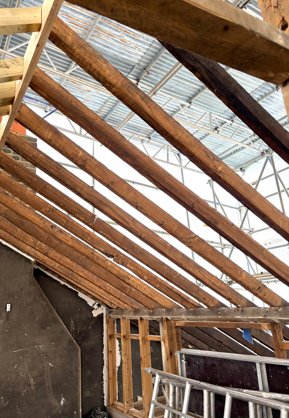 Fire damaged roof timbers in London property after dry ice blasting