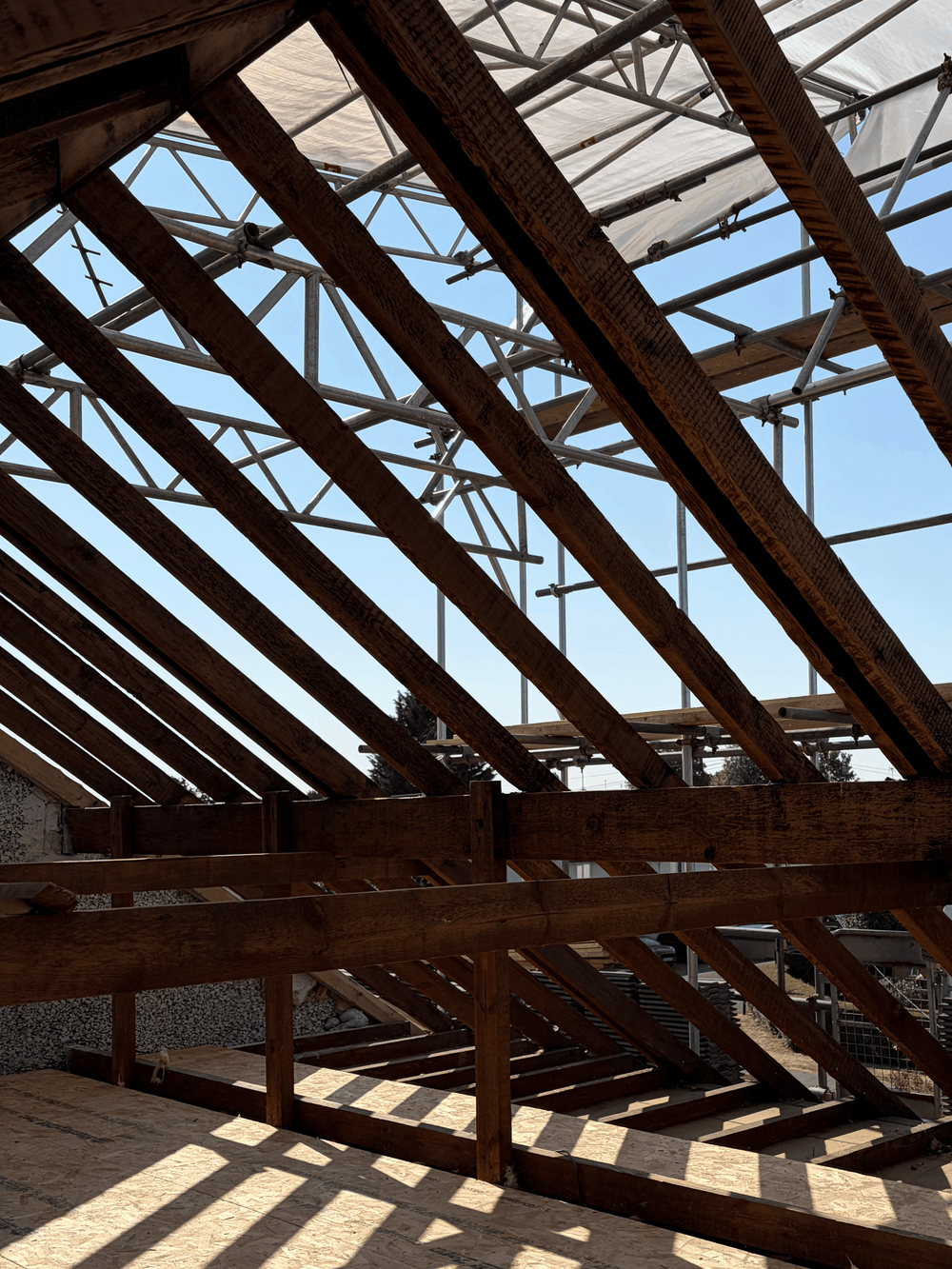Fire, smoke and soot damaged roof timbers before dry ice blasting