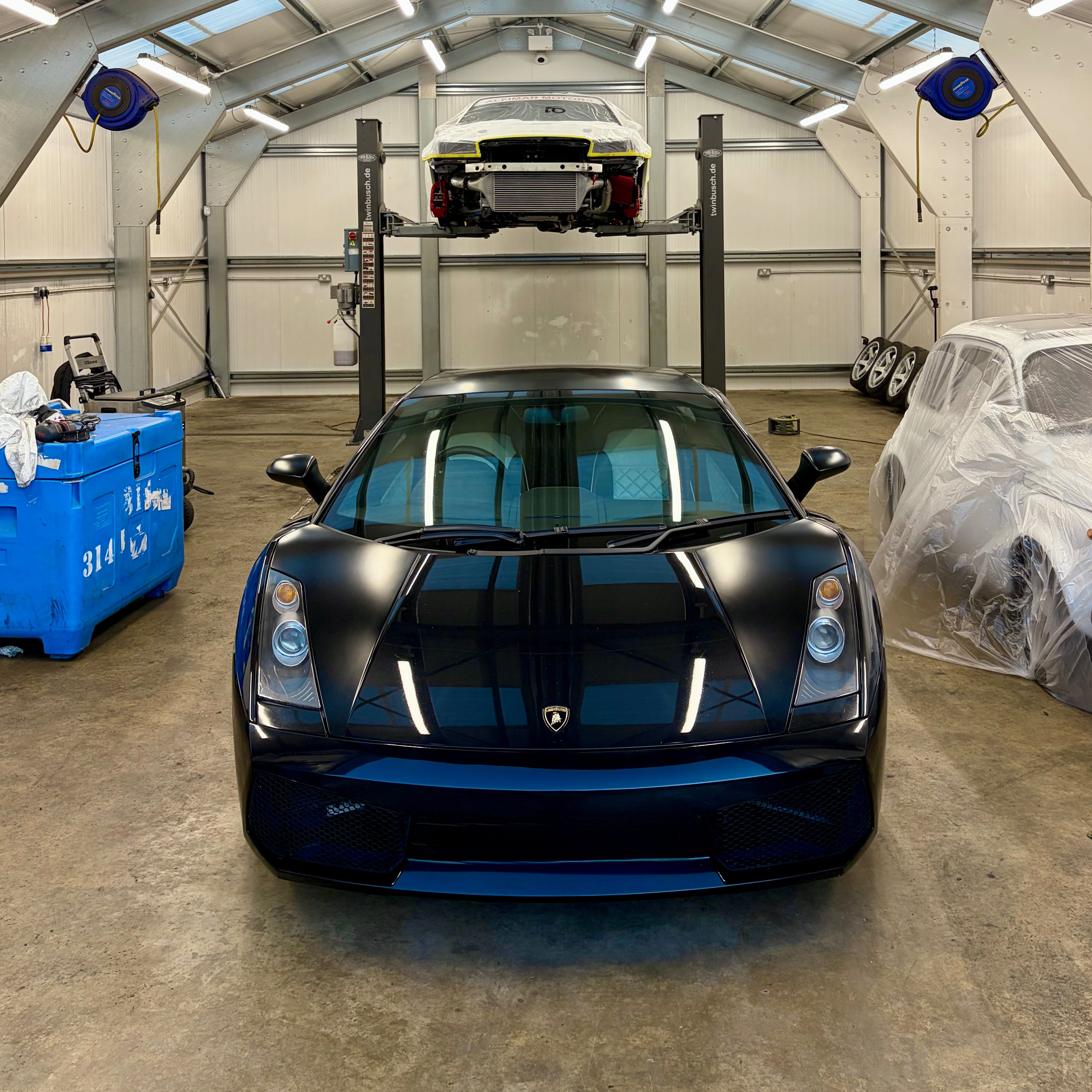 A black Lamborghini Gallardo at EVOGENIC facility for dry ice blasting and underbody protection