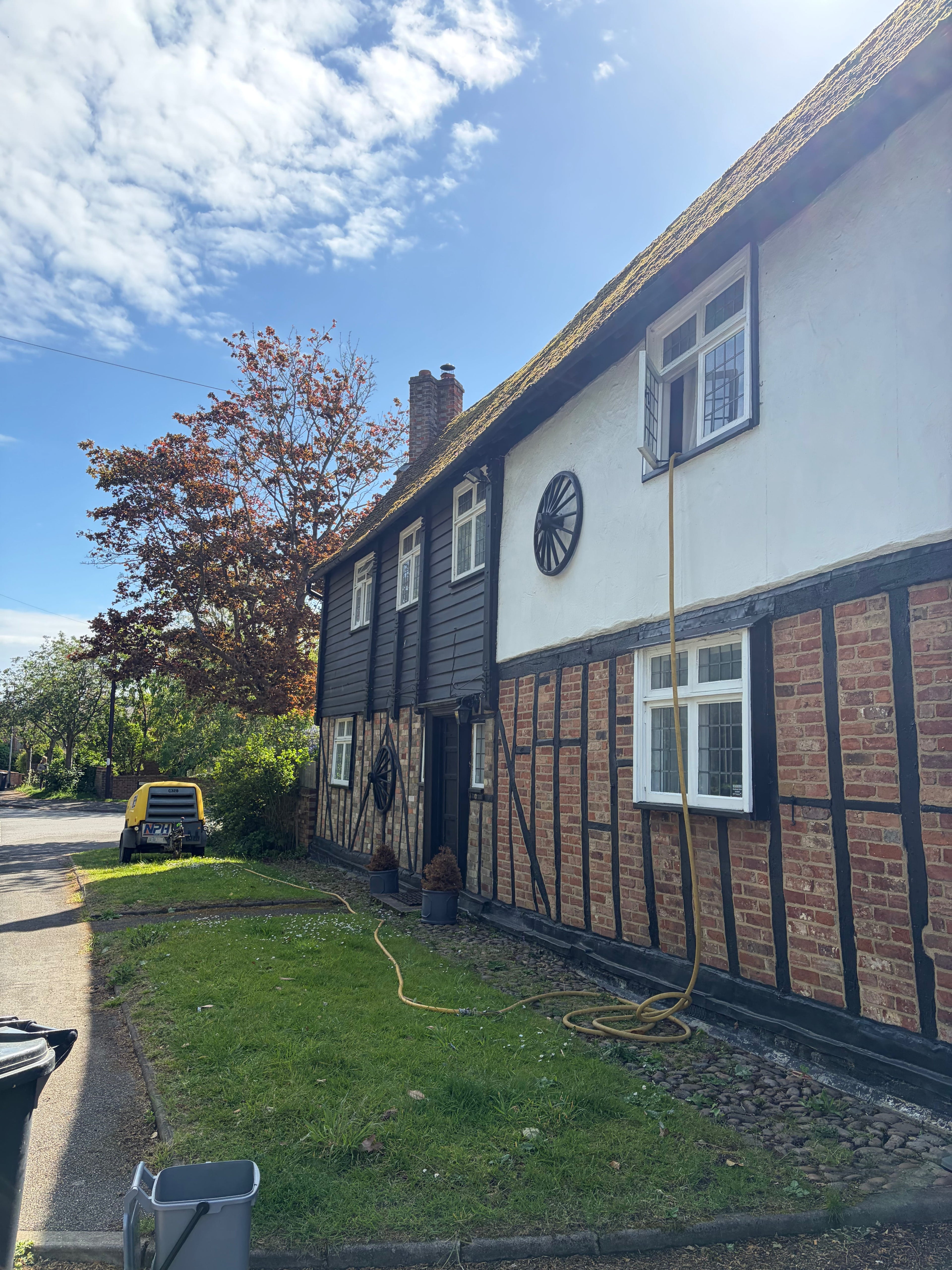 Period property with air compressor and dry ice blasting preparations outside