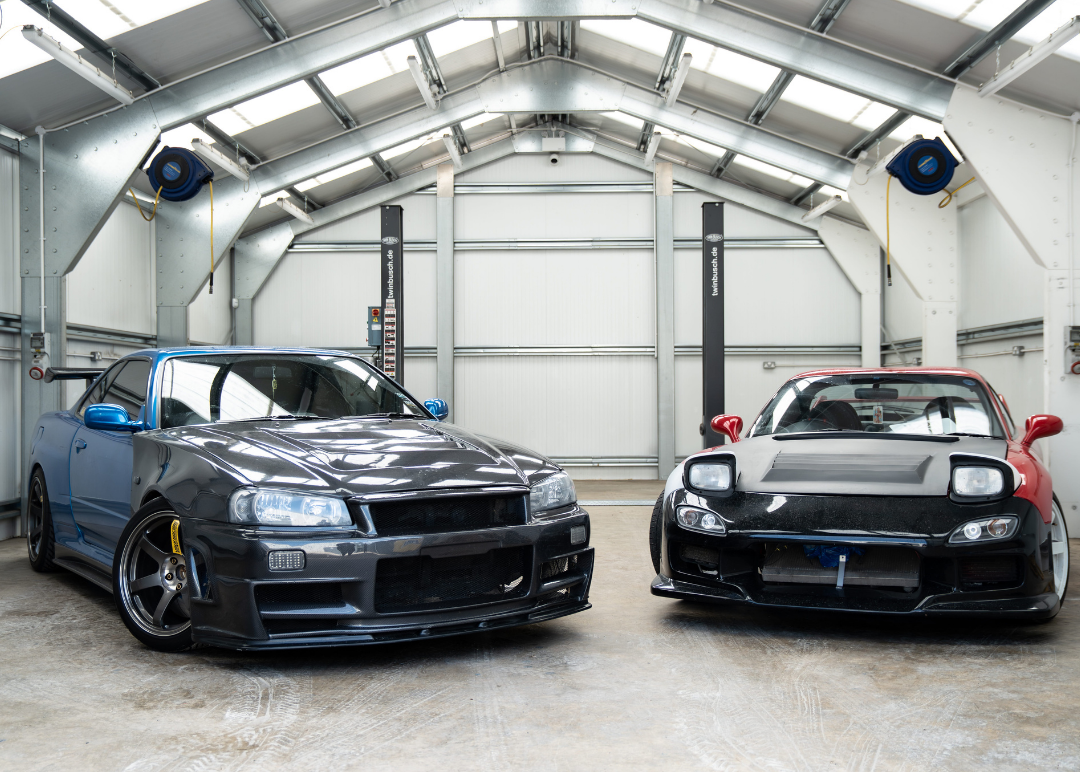 Nissan R34 and Mazda Rx7 parked in dry ice blasting workshop