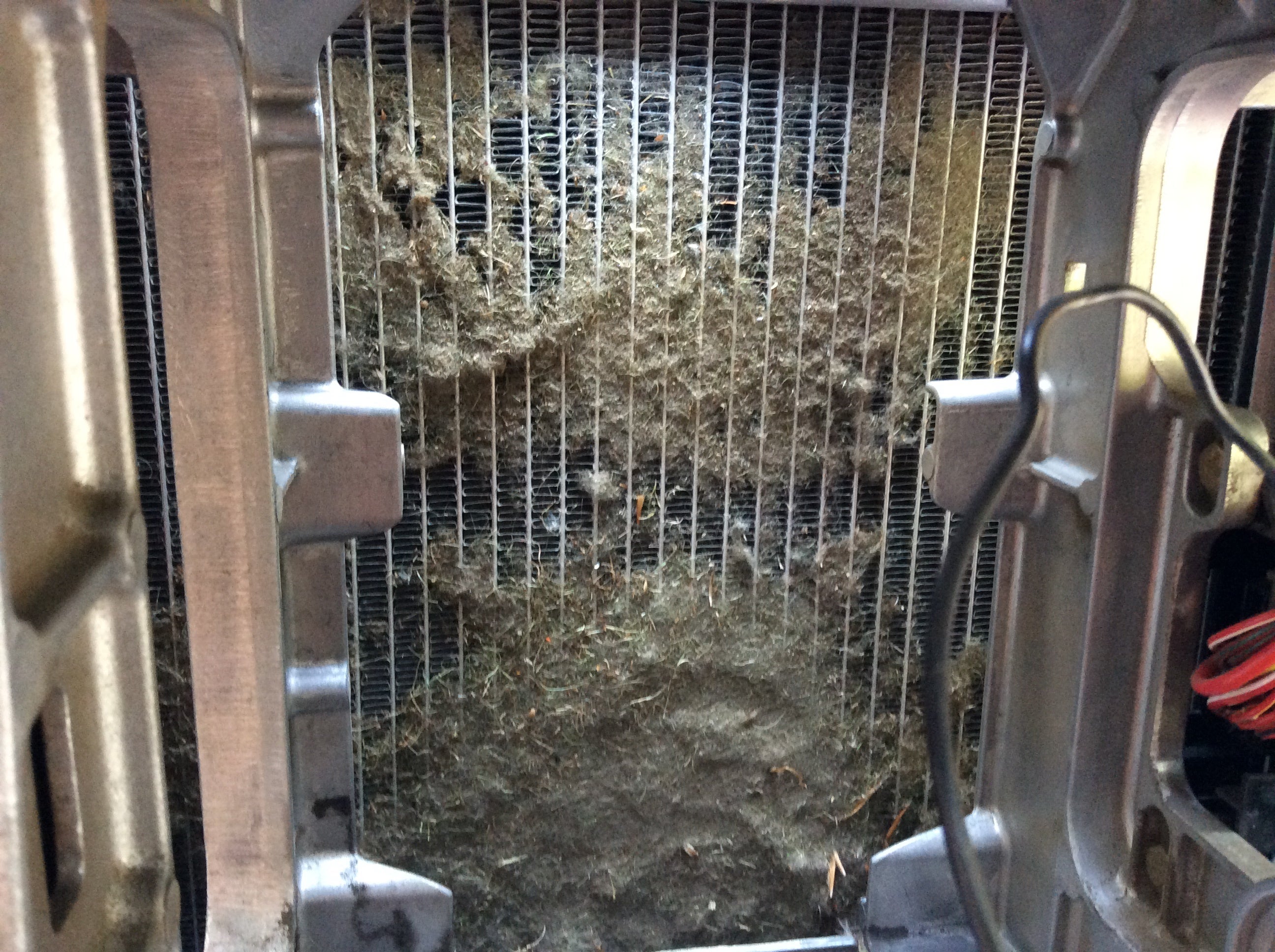 Clogged John Deere tractor radiator before dry ice blasting
