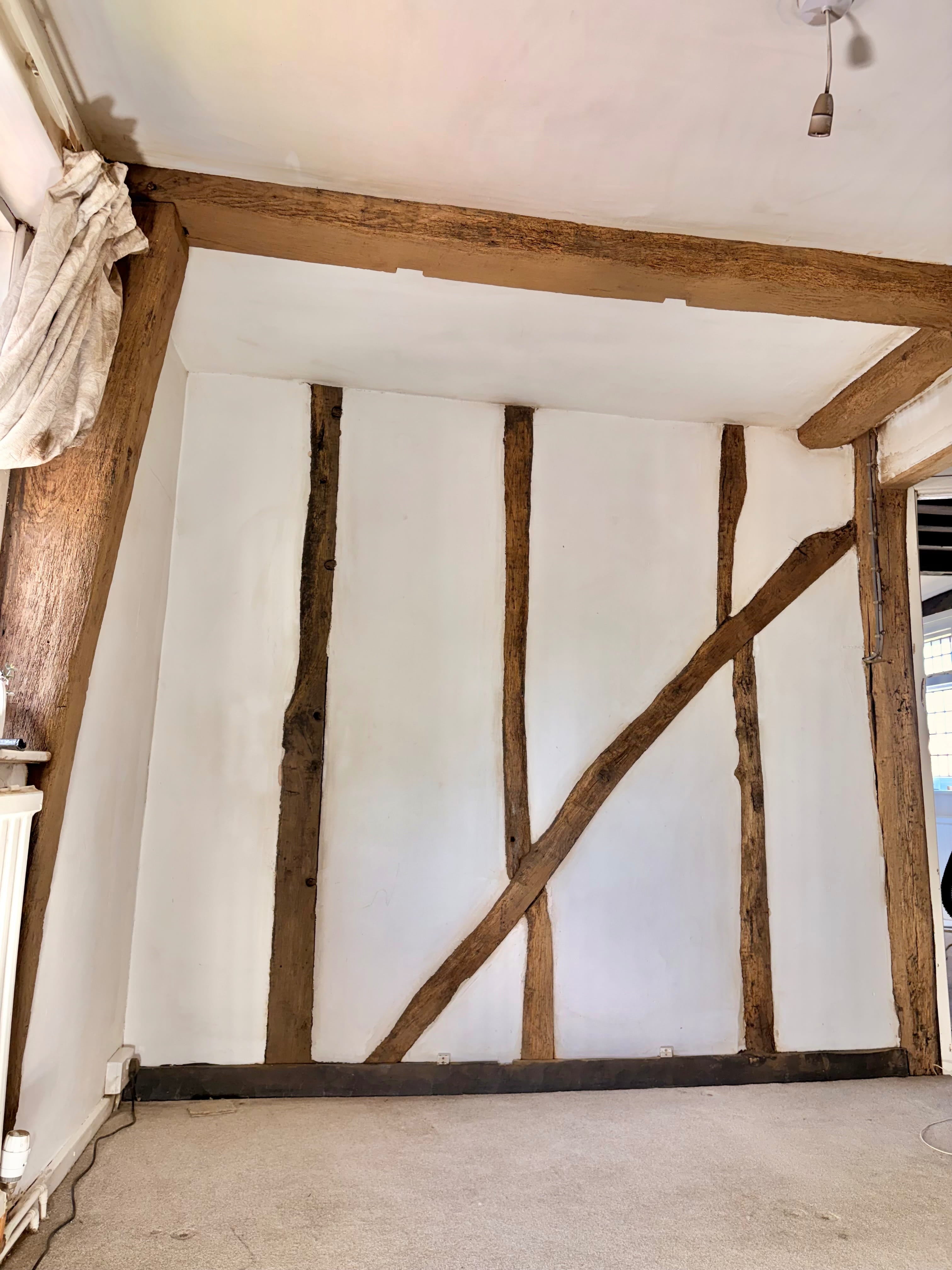 Wooden beams painted black before dry ice blasting paint removal
