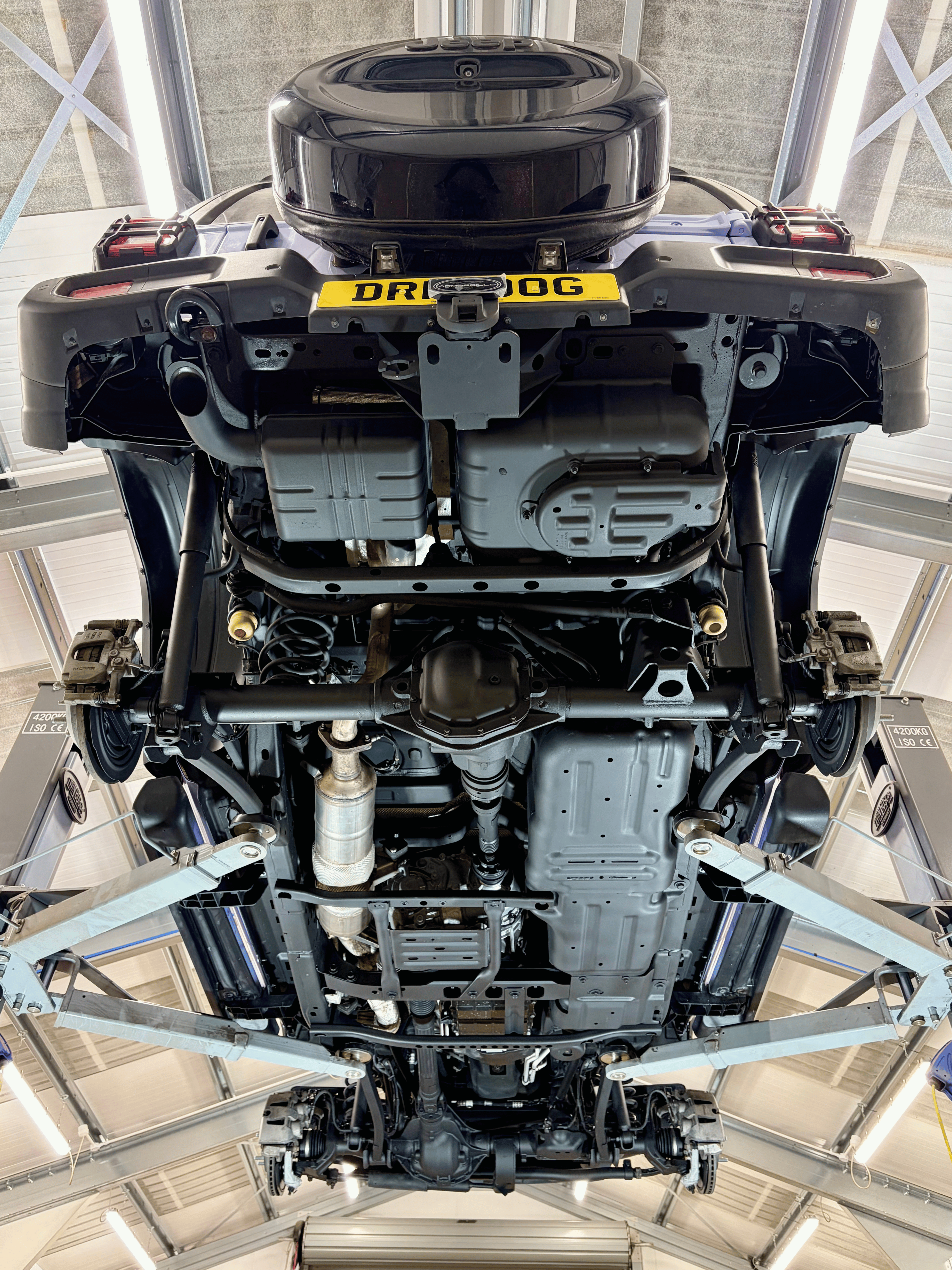 Underside of 4x4 on lift before dry ice blasting and underbody protection