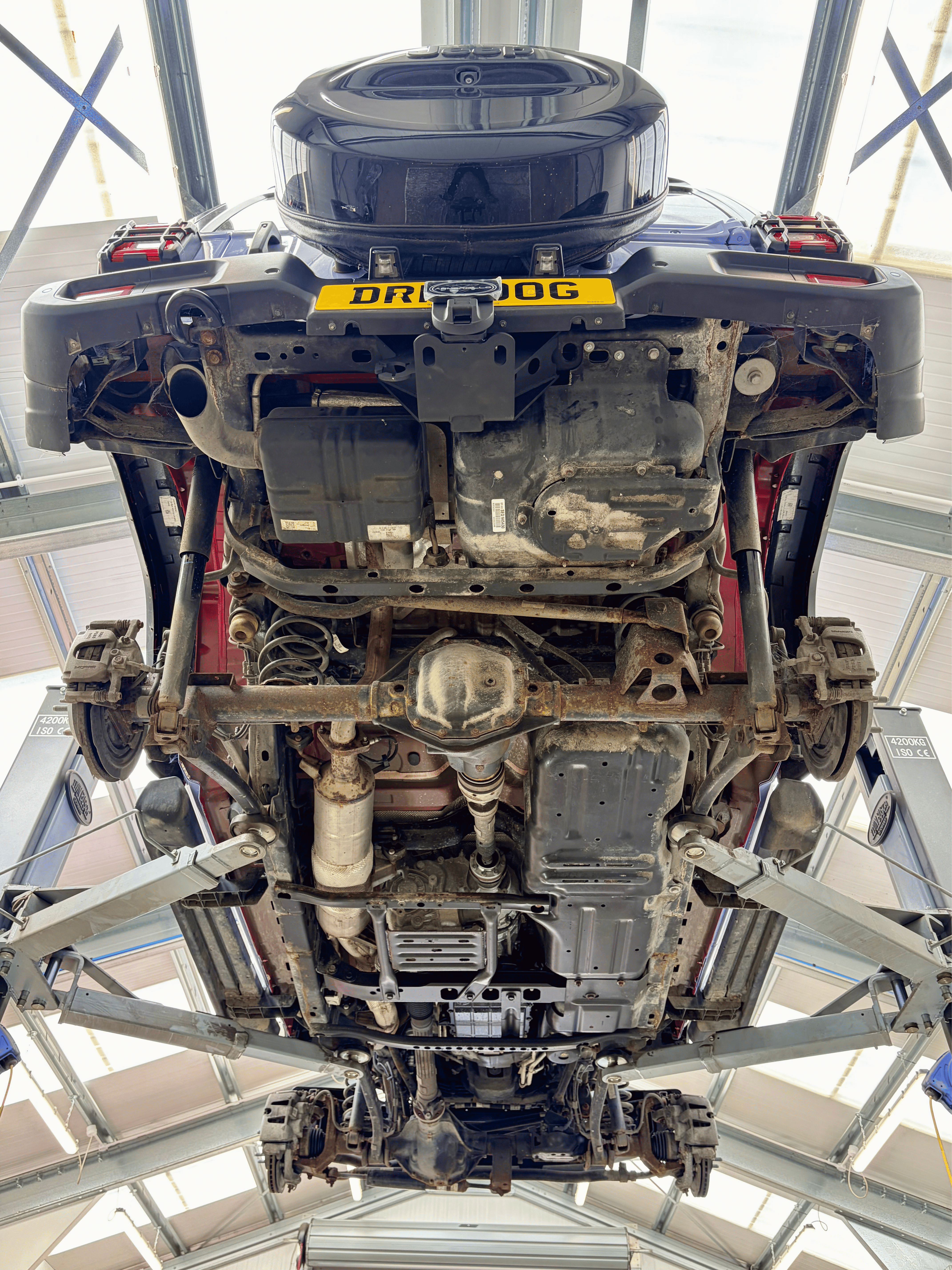 Underside of 4x4 on lift before dry ice blasting